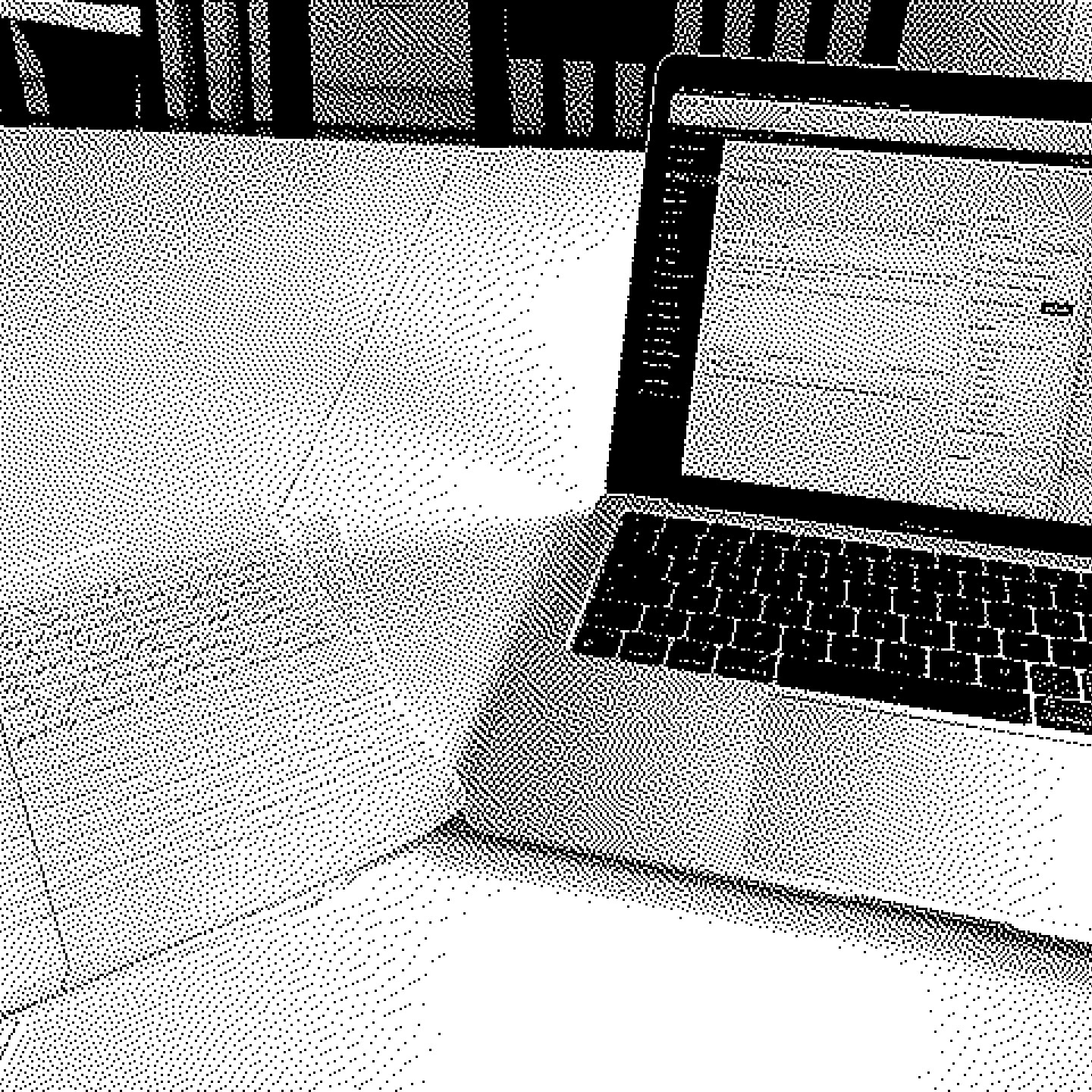 A pixelated photo of my notebook and laptop
